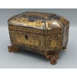 A 19th Century Chinese export laquered tea caddy, the hinged cover enclosing a two division