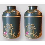 A pair of Toleware covered cannisters each with Chinoiseie decoration in gilt upon a green ground,