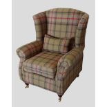 A Plaid upholstered wingback armchair