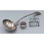 A George IV silver ladle, London 1828, makers mark WE, together with a silver toast rack and a