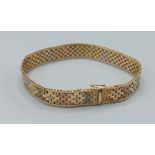 A 9ct tri colour gold flat link bracelet, 18cms long, 14.1gms