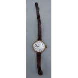 A 9ct gold cased wristwatch by Waltham with leather strap, 27gms including movement