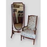A mahogany cheval mirror the shaped bevel edged mirror with carved and fluted uprights upon splay