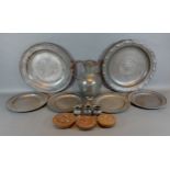 A pewter large plate together with other items of pewter and three butter pats