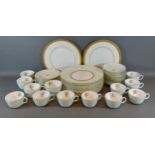 A Minton twelve place setting tea service together with two Minton dinner plates