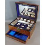 A 19th Century walnut dressing case, the hinged top above a fitted interior to include silver plated