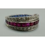 A white metal day and night hinged full eternity ring, set with diamonds, rubies and sapphires, 3.