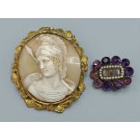 A cameo brooch relief carved with the bust of a roman soldier within a foliate gilt frame, 6cms by