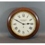 An oak cased circular wall clock by Garrard, retailed by Leo Williams Petersfield, 34cms diameter