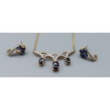 A 9ct gold necklace set with diamonds and sapphires with flat link chain together with a pair of