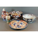 A 19th Century Imari bowl together with a similar vase, an Imari dish, a Crackleware vase and a