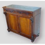 A William IV Rosewood chiffonier, the moulded top above two drawers with nob handles and two panel