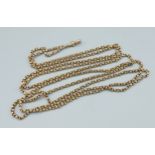 A 15ct yellow gold long linked guard chain, 84cms long, 47.7gms