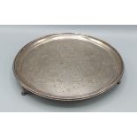 A Victorian silver salver of circular form, London 1886, maker William Hutton and Sons, 19ozs, 26cms