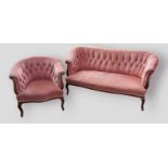 A Victorian mahogany sofa, the buttoned upholstered back with scroll arms raised upon cabriole