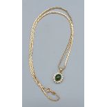 A 14ct gold pendant set with a cabochon green stone surrounded by clear stones together with a