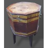 A George III mahogany and brass bound wine cooler of octagonal form with a hinged top above side