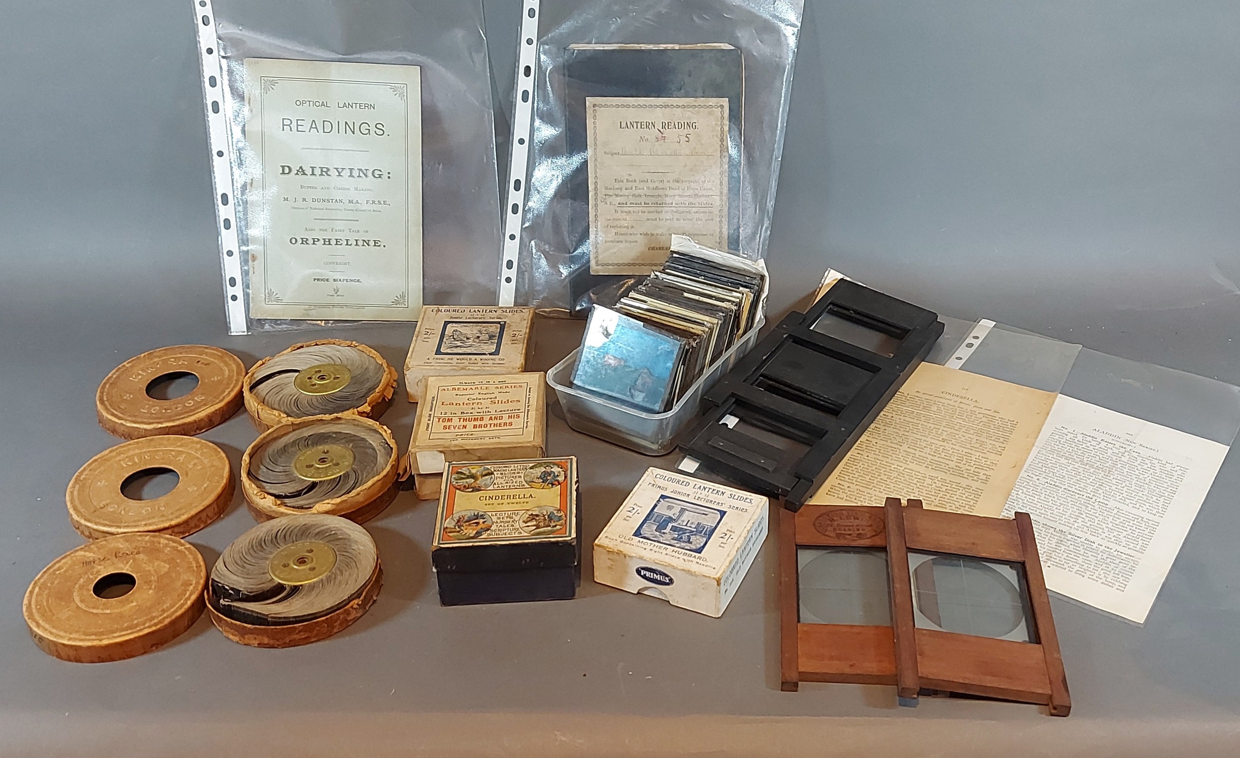 A collection of Magic Lantern slides together with three Kinora viewing rolls and related items