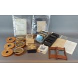 A collection of Magic Lantern slides together with three Kinora viewing rolls and related items