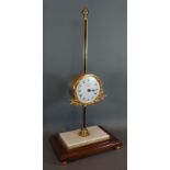 Thwaites and Reed Clerkenwell London, a gravity table clock with variegated marble and wooden