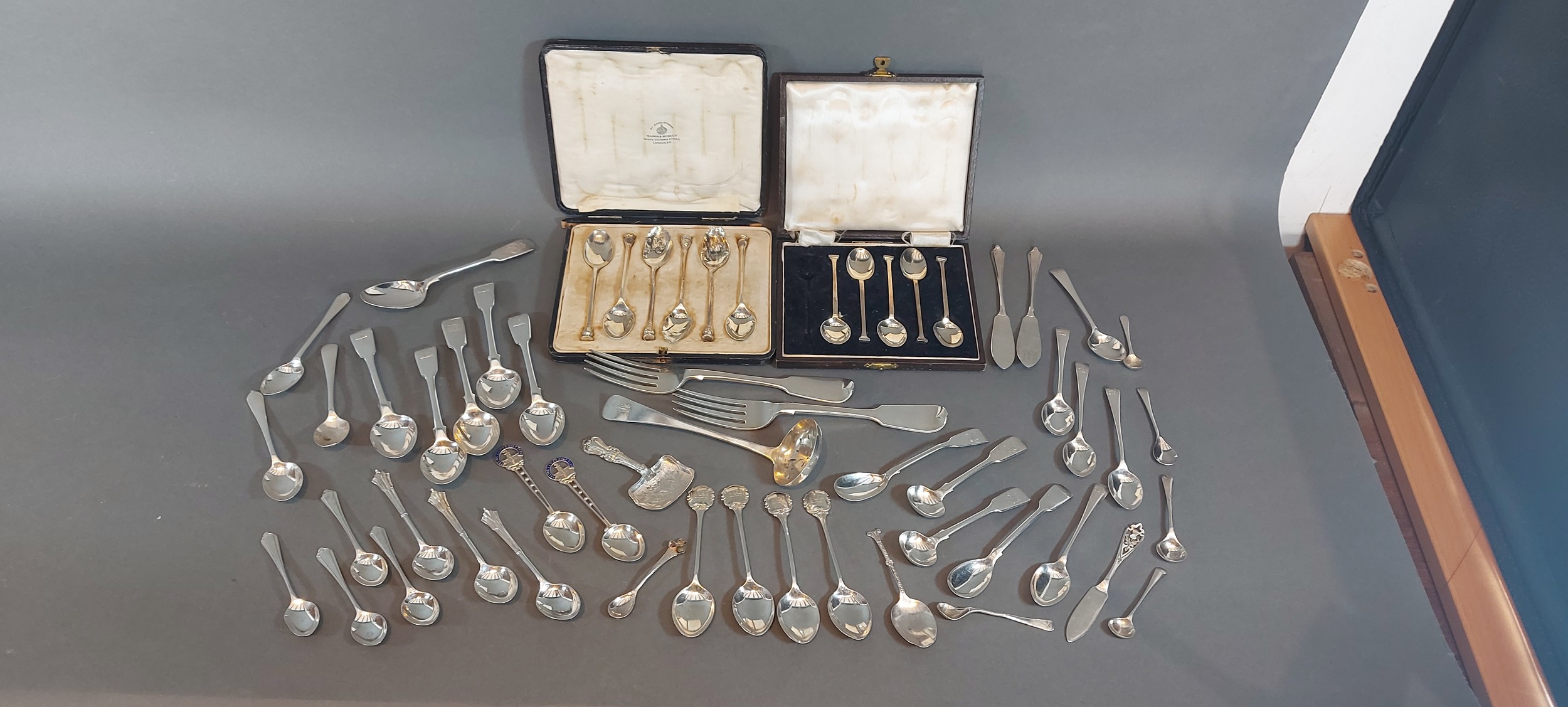 A collection of silver flatware to include mainly spoons and two cased sets, 27ozs