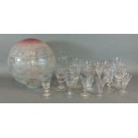 A collection of early drinking glasses together with a engraved glass oil lamps shade