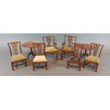 A set of six miniature Chippendale style dining chairs together with two miniature pedestal tables