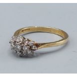 An 18ct gold diamond cluster ring, claw set, 4.5gms, ring size T