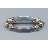 A Danish 830 silver brooch by Georg Jensen number 141, 2cms by 4cms