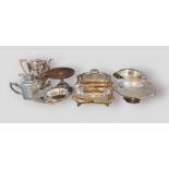 A collection of silver plated items to include an entrée dish, various trays and a pair of