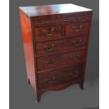 A 19th Century mahogany small chest with a brushing slide above two short and three long drawers
