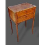 An Edwardian mahogany and satinwood inlaid work table with two drawers raised upon square tapering