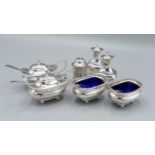 Two Birmingham silver mustards together with two similar salts, a pair of peppers and another