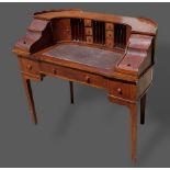 A mahogany Carlton House desk, the superstructure with drawers, cupboards and alcoves above three