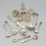 A Victorian silver pepper, Birmingham 1893, together with four silver napkin rings and a small