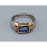 An 18ct two tone gold Sapphire ring, set with single rectangular Sapphire, ring size F, 3.7gms