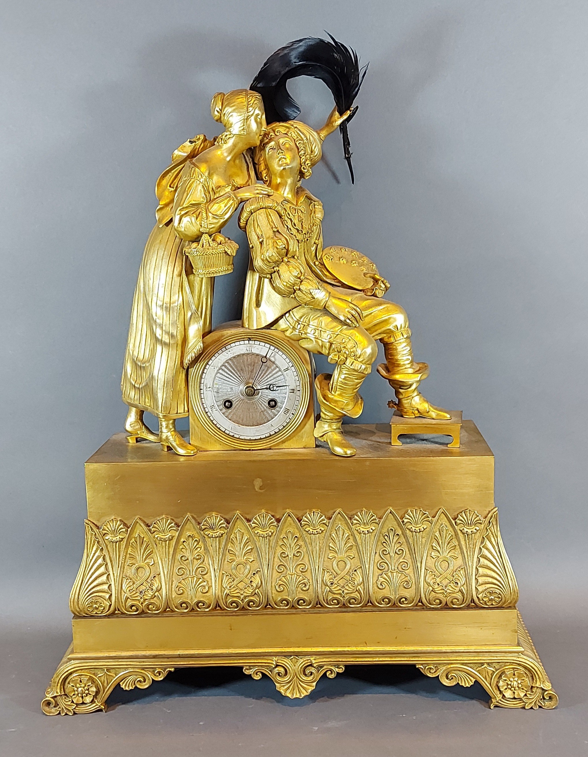 A 19th Century French Ormolu mantle clock with two figures, 'The Artists', the silvered dial with