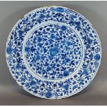 An 18th Century Delft blue and white decorated deep dish, 34cms diameter