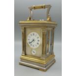 A late 19th or early 20th Century French brass and silvered carriage clock, the painted enamel