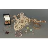 A collection of jewellery to include various dress rings, bead necklaces, brooches and earclips