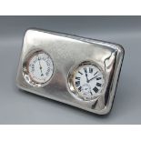 A white metal and leather cased desk clock and barometer, with folding stand, 19.5cms wide