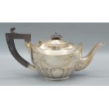 A Birmingham silver bachelors teapot of shaped form with ebonised handle, 8ozs