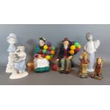 A Royal Doulton figure The Old Balloon Seller, together with another similar The Balloon Man, a