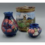 A Moorcroft Anemone pattern vase, 14cms tall together with another Moorcroft small vase, 7cms tall