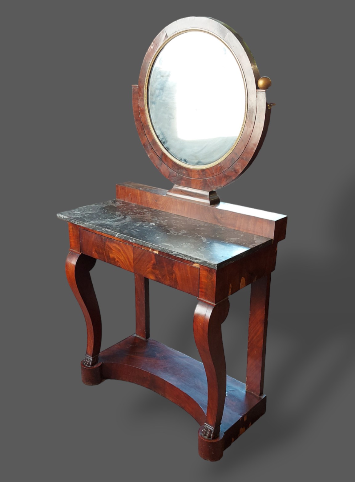 A 19th Century French Empire style dressing table, the circular mirror above a variegated marble top