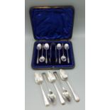 A set of six Sheffield silver Apostle coffee spoons with matching sugar tongs within fitted case,