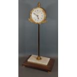 Thwaites and Reed Clerkenwell London, a gravity table clock with variegated marble and wooden