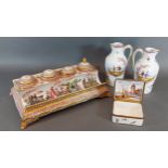 A Naples porcelain inkwell together with a pair of continental jugs and a similar box