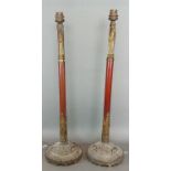 A pair of patinated metal Days Patent telescopic candlesticks converted to table lamps, with
