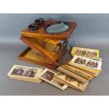 An early 20th Century stereo viewer together with viewer cards